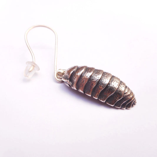 A photo of a silver earring in the shape of a woodlouse.